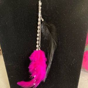 Black leather cord with silver tone rhinestone and feather pendant